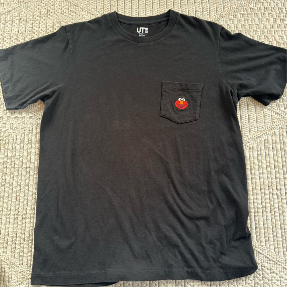 Uniqlo x KAWS x Sesame Street Elmo pocket t-shirt.